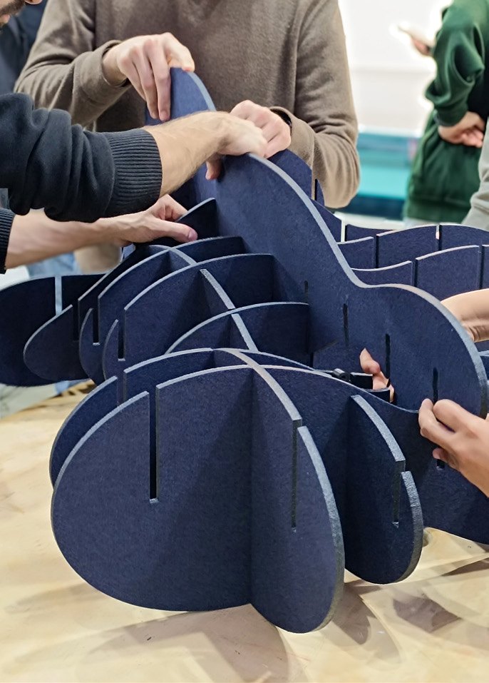 Students assembling a circular fabricated prototype.
