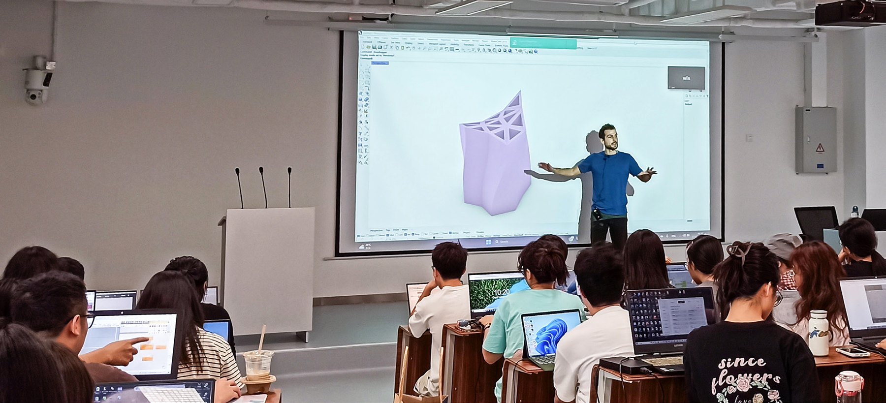 Students attending a digital fabrication course lecture.