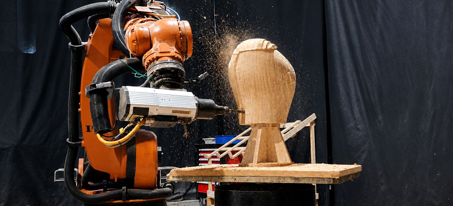 Industrial robot milling a laminated prototype.